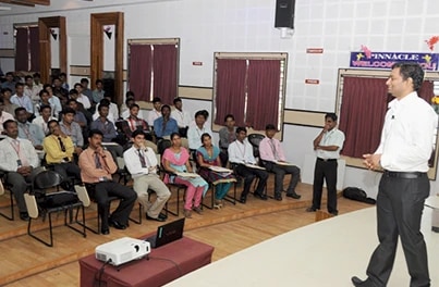 Speaker presenting to a seated audience